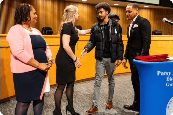 A graduate with supporters
